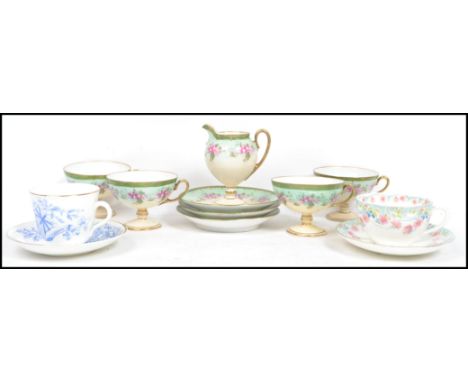 A pretty Victorian bone china six person  tea service with green applied borders to the cups with hand painted floral details