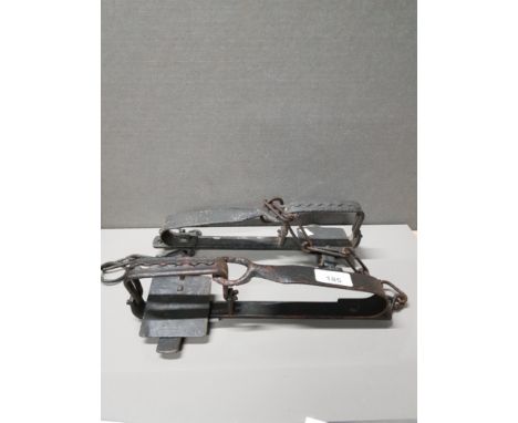 PAIR OF ANTIQUE IRON GIN TRAPS
