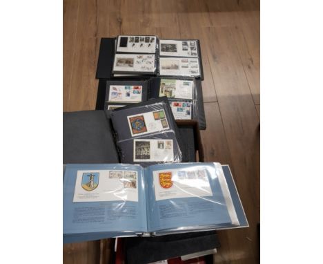 A BOX CONTAINING 8 FIRST DAY COVER ALBUMS