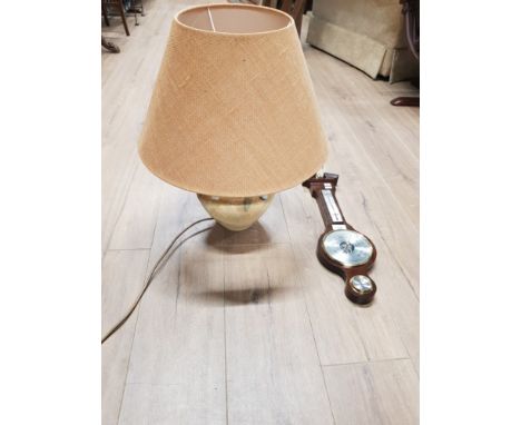 A BAROMETER WITH A TABLE LAMP