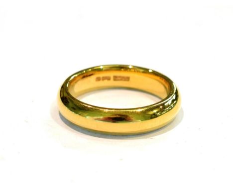 An 18 carat gold band ring, finger size R.  Gross weight 10.1 grams. 