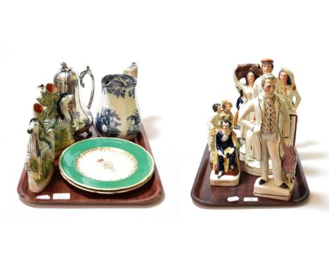 A quantity of Staffordshire flat-back figures, a Staffordshire pocket watch stand, a pair of Staffordshire zebra spill holder