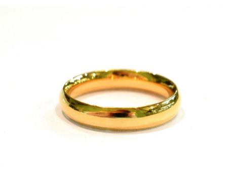 An 18 carat gold band ring, finger size U.  Gross weight 7.6 grams. 