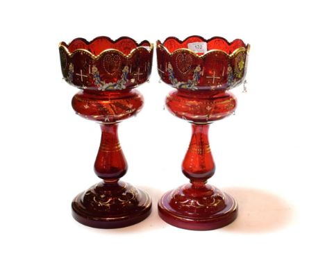 A pair of Victorian gilt highlighted ruby glass table lustres