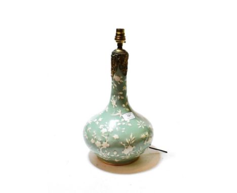 A Chinese porcelain bottle vase with a celadon glaze decorated with flowers, converted to a table lamp (a.f.)