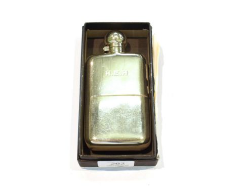 A George V silver spirit flask, by The Army and Navy Cooperative Society Ltd., London, 1912, oblong, with pull off cup and ba