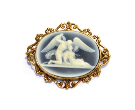 A 9 carat gold cameo brooch within a scroll surround, measures 5.5cm by 4.5cm .&nbsp; Gross weight 16.3 grams.