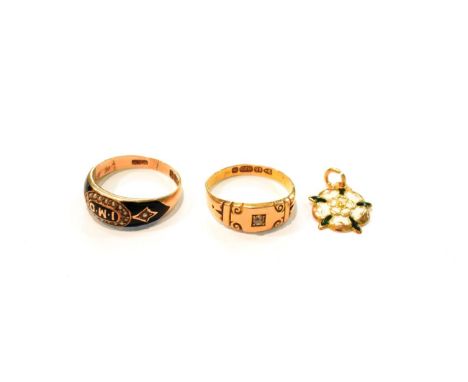 A Victorian 18 carat gold enamel mourning ring, finger size O; a 15 carat gold diamond solitaire ring, finger size N1/2; and 