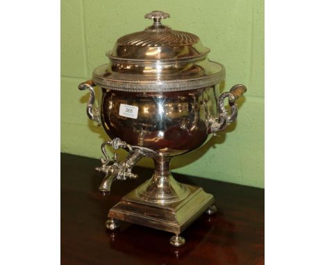 A silver-plated tea-urn, 19th century, tapering and with tapering tap, on square base with four bun feet, the pull-off cover 