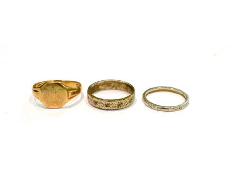 A 9 carat gold signet ring, finger size Q1/2; a band ring stamped 'PLATINUM', finger size L1/2; and a 9 carat white gold text