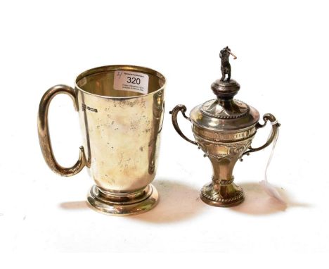 A George V silver golf trophy and a George V silver mug, the first by Joseph Rogers and Sons, Sheffield, 1935, the second by 