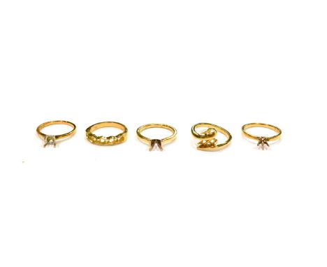 Five 18 carat gold vacant ring mounts, of varying designs and finger sizes (5).  Gross weight 17.2 grams. 