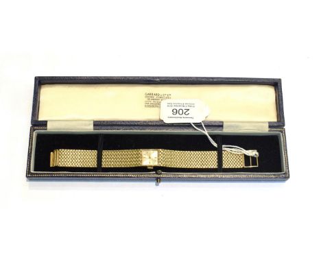 A 9 carat gold ladies wristwatch signed Jean Renet, with a Garrard &amp; Co ltd box