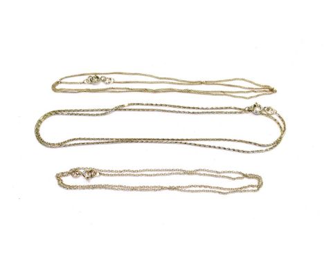 Two 18 carat white gold chains (one trace link, the other fancy link), lengths 41cm and 46cm; and a 9 carat white gold trace 