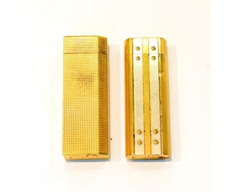 Two Cartier roller lighters numbered 378655 and 82849I
