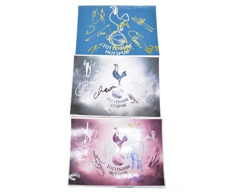 Three signed Tottenham Hotspur A4 club badges, including Andros Townsend, Roberto Soldado, Zeki Fryers, Christian Eriksen and