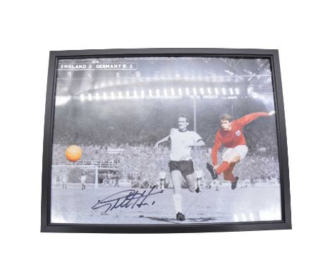 Signed Geoff Hurst coloured print, 43cm x 33cm, glass frame damaged