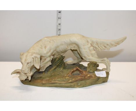 A vintage Royal Dux hunting dog figure 