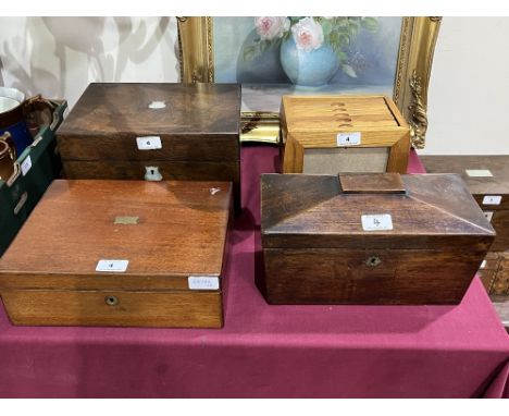 A Victorian rosewood travelling dressing box with plated topped jars; a mahogany writing slope; a rosewood sarcophagus tea ca