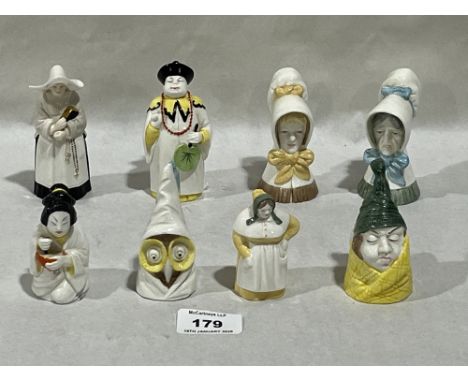 Eight Royal Worcester figural candle snuffers.