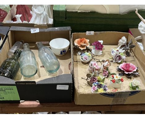 Two boxes of old bottles, ceramic and metal roses etc.