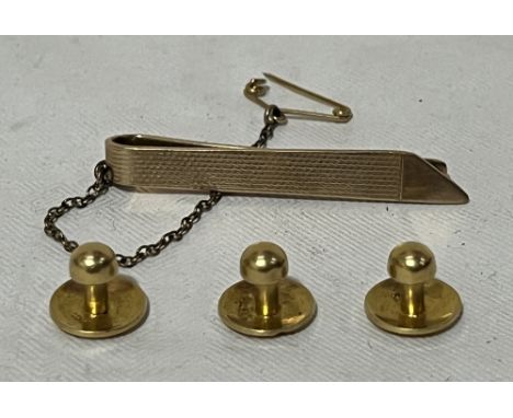 Three 18ct shirt studs, 4g and a 9ct tie clip. 4g