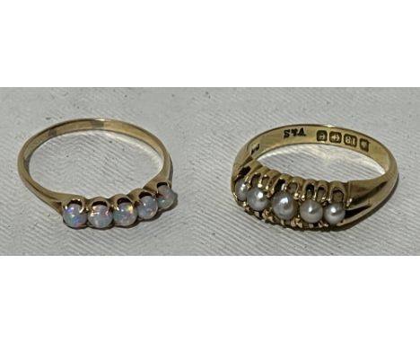 An Edwardian split pearl ring. In gold marked 18. 5g gross. Size N. The lot to include an opal ring marked 14. 1g gross 