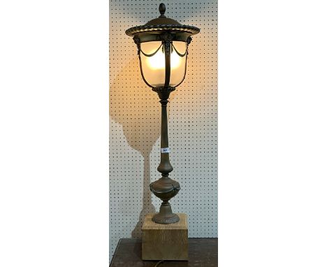 An early 20th Century electroplated newel post lamp with frosted glass shade on wood base. 42" high.