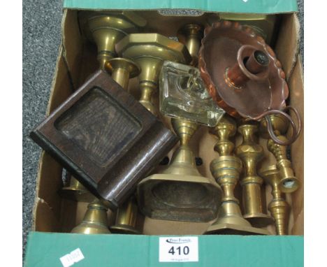 Box of assorted metalware, mainly brass candlesticks, copper chamber stick etc. Together with a glass inkwell. (B.P. 24% incl