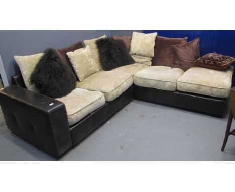 Modern leather and upholstered corner sofa with cushions.(B.P. 24% incl. VAT)