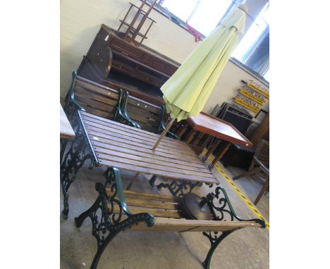 Modern garden suite to include; bench, two armchairs, table and umbrella, all with cast metal frames. (B.P. 24% incl. VAT) 