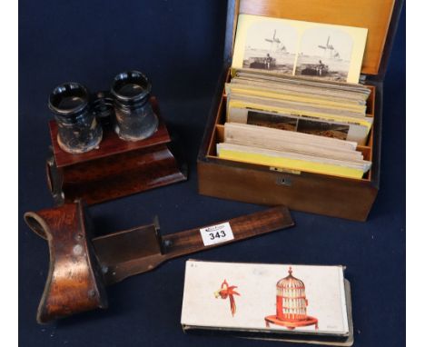 Tray of vintage stereoscopic slides in walnut box, together with a vintage walnut mounted binocular view finder and 'Dr Well'