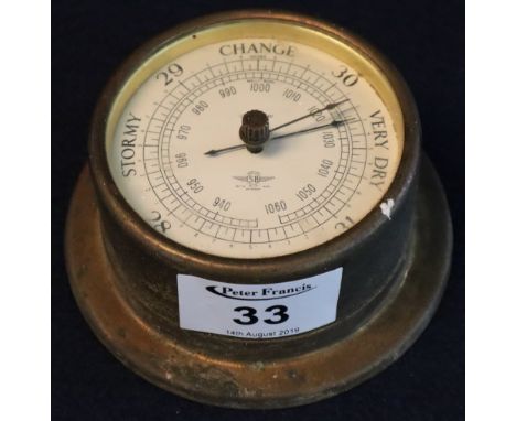 Small bulkhead type Shortland Smiths brass cased barometer. 10cm diameter approx. (B.P. 24% incl. VAT)