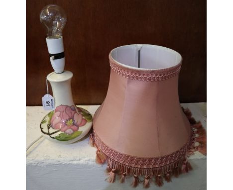 Moorcroft art pottery baluster shaped lamp base with tube lined floral decoration on cream ground and shade. Impressed mark. 