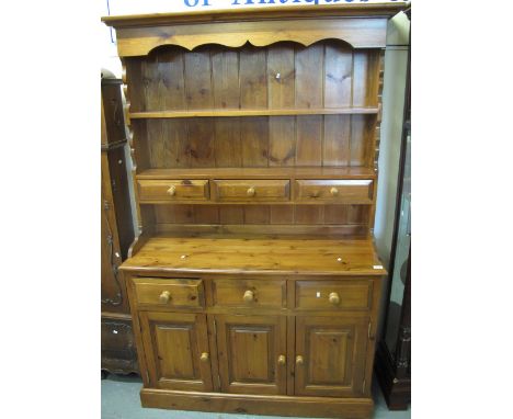 Modern pine two stage rack back dresser with fitted spice drawers on a platform base. (B.P. 24% incl. VAT)