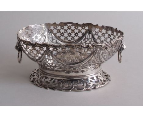 An Art Deco silver bonbon dish, by William Hutton &amp; Sons, London 1922, of oval form, the pierced body decorated with swag