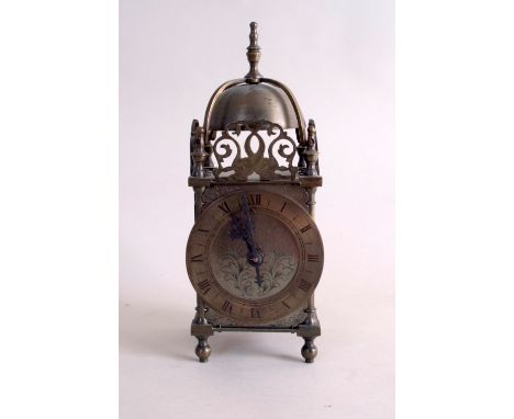 A late 19th/early 20th century brass lantern clock, by Mappin & Webb, circa 1900, pierced gallery depicting fish to three sid