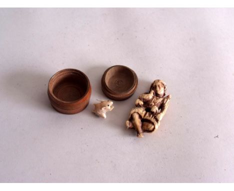 A 19th century export Japanese Netsuke carved ivory figure, in the form of a seated boy and lamb, 7 1/2cmH, with a carved ivo