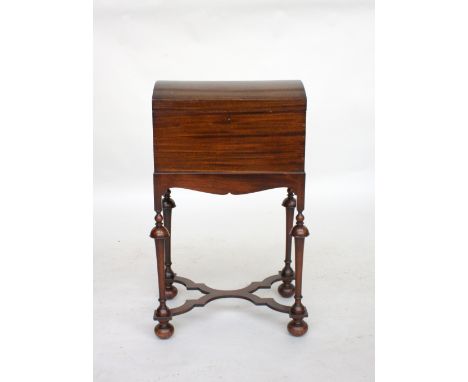 A 19th century caddy-top sewing box on stand, in 17th century style, the domed mahogany hinged lid revealing compartmental la
