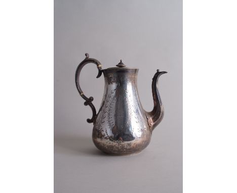 A Victorian silver coffee pot, by John Wakefield, London 1877, of tapering baluster form, foliate engraving, scrolling handle