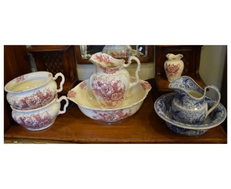 Blue transfer printed pottery 'Birds of Paradise' pattern wash hand jug and basin, together with a red transfer printed part 
