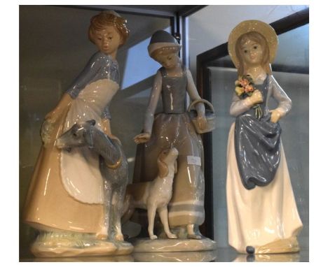 Two Nao figures - Goat Girl and Girl with Dog and one other Spanish figure of a girl holding a bunch of flowers (Goat Girl 30
