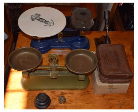 Two pairs of early 20th Century grocer's cast iron scales, the first blue painted stamped Fairbanks with black transfer print