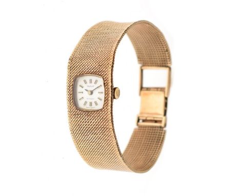 Lady's 9ct gold cased Tissot 'Stylist' cocktail watch having integral textured strap, the champagne dial with baton markers  