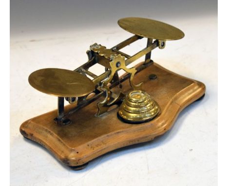 Brass postage scale on shaped beech base with brass weights   Condition: 