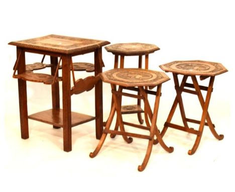 Four early 20th Century carved oak occasional tables comprising: a rectangular example with four drop down serving flaps and 
