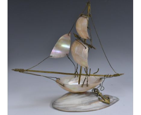 An early 20th century mother of pearl and gilt metal model, of a ship, 26cm long