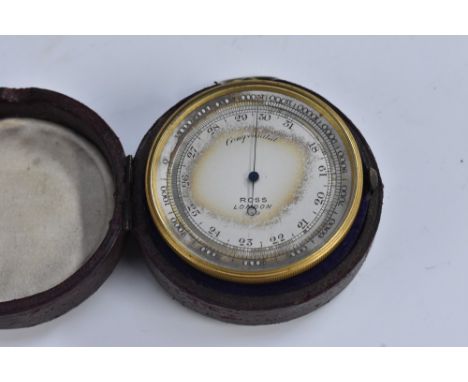 A 19th century lacquered brass travelling pocket barometer, 5cm silvered register inscribed Ross, London, 7cm over loop, c.18