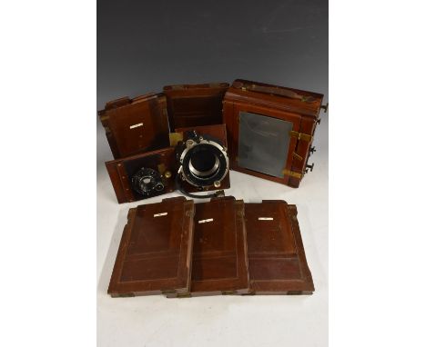 Photography - a Sanderson's patent plate camera, mahogany and laquered brass body, serial number 9109; lens board mounted wit