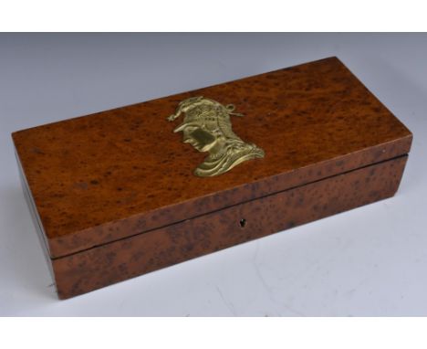 A 19th century gilt metal mounted amboyna rectangular glove box, the hinged cover with a profile portrait of a Classical sold